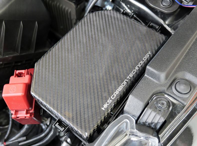 HKS 2023+ Toyota GR Corolla Dry Carbon Fuse Box Cover - 70026-AT014